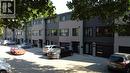 Modern townhome exteriors featuring light gray brick and dark gray horizontal siding - 71 Blucher Street Unit# G, Kitchener, ON 