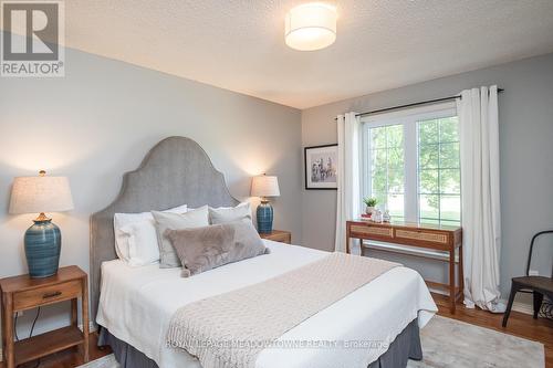 Main-floor bedroom, ideal for guests or family use - 11276 Amos Drive, Milton, ON 