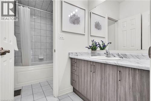 Main Bathroom with vanity area and tub and toilet area separated - 101 Westfield Crescent, Waterdown, ON 