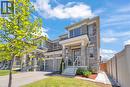 Contemporary residential exterior featuring stone and brick accents - 101 Westfield Crescent, Waterdown, ON 