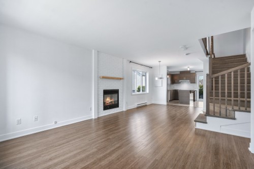 Salon - 671 Rue De Pompadour, Mascouche, QC - Indoor Photo Showing Living Room With Fireplace