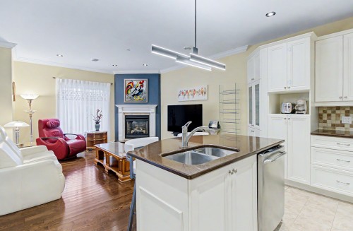 Overall view - 206-3000 Boul. De Boucherville, Saint-Bruno-De-Montarville, QC - Indoor Photo Showing Kitchen With Fireplace With Double Sink