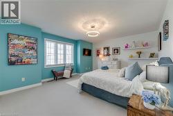 Spacious room featuring carpeting, a multi-pane window with blinds, and recessed lighting - 