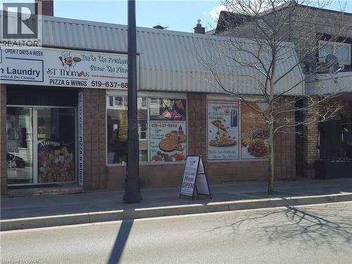 Commercial storefront featuring two distinct units under a corrugated metal awning - 71 Ross Street Unit# 2, St. Thomas, ON 