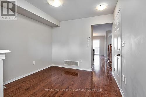 Living Room Boasts Gleaming Hardwood Flooring - 3221 Sharp Road, Burlington, ON - Indoor Photo Showing Other Room