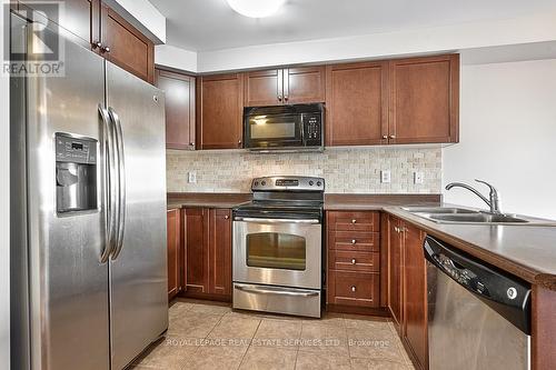 Gourmet Kitchen Offers Stainless Steel Appliances - 3221 Sharp Road, Burlington, ON - Indoor Photo Showing Kitchen With Stainless Steel Kitchen With Double Sink