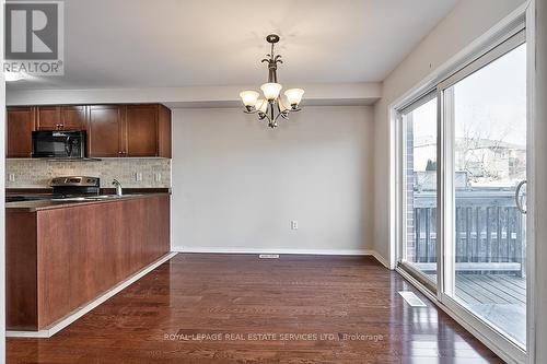 Dining Room with a Sliding Door Walkout to Deck - 3221 Sharp Road, Burlington, ON - Indoor Photo Showing Kitchen