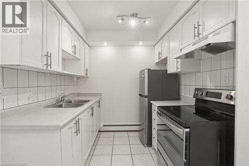 30 Summit Avenue Unit# 401, Hamilton, ON - Indoor Photo Showing Kitchen With Double Sink