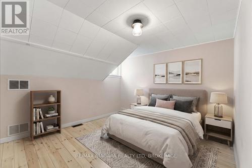virtually staged bed - 696 Lakeshore Road, Fort Erie (Lakeshore), ON - Indoor Photo Showing Bedroom