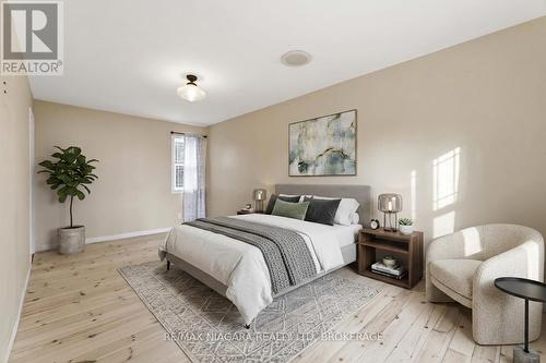 virtually staged bed - 696 Lakeshore Road, Fort Erie (Lakeshore), ON - Indoor Photo Showing Bedroom