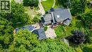 Multi-level residence featuring a dark shingle roof, bay window, and a rear patio - 2032 Coronation Boulevard, Cambridge, ON  - Outdoor 