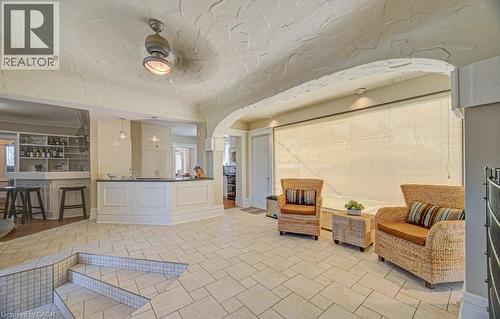 Spacious room featuring tile flooring, a multi-level floor plan, and an arched entryway - 2032 Coronation Boulevard, Cambridge, ON - Indoor Photo Showing Other Room