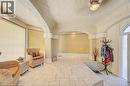 Tiled flooring throughout this versatile interior space featuring arched ceilings, recessed lighting, and expansive windows fitted with blinds - 2032 Coronation Boulevard, Cambridge, ON  - Indoor Photo Showing Other Room 