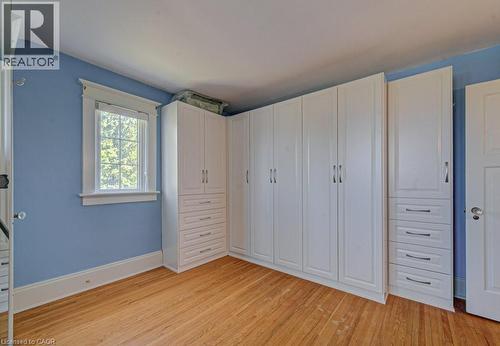 Expansive built-in white cabinetry with chrome hardware - 2032 Coronation Boulevard, Cambridge, ON - Indoor