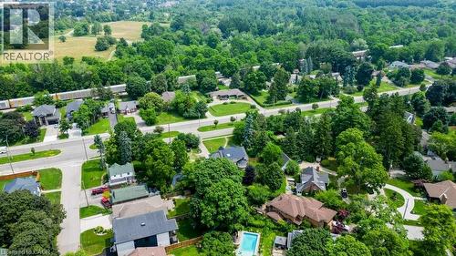 Aerial perspective showcasing a residential area with mature trees, established roads, and varied housing styles - 2032 Coronation Boulevard, Cambridge, ON - Outdoor With View