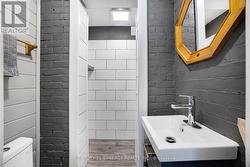 Main floor 3pc bath with walk-in rain shower. - 
