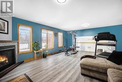 Family room over garage with gas fireplace. - 