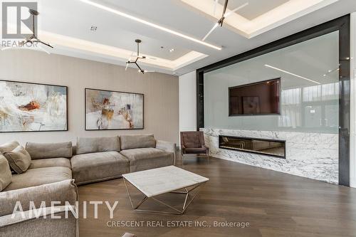 Th101 - 99 Eagle Rock Way, Vaughan, ON - Indoor Photo Showing Living Room With Fireplace
