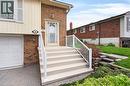 Brick and siding exterior with concrete steps and white railings - 56 Brookstream Court, Hamilton, ON  - Outdoor 