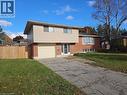 Split-level residence featuring a brick and siding exterior, single-car garage, and a fenced side yard - 66 Summit Avenue, Kitchener, ON  - Outdoor 
