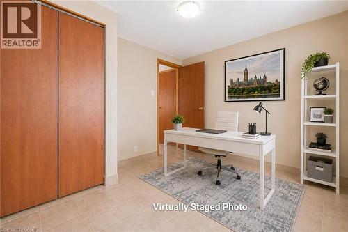 Room featuring light beige wall color, tan tile flooring, and a flush-mount ceiling light fixture - 66 Summit Avenue, Kitchener, ON - Indoor Photo Showing Office