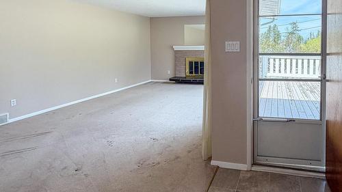 811 28Th Avenue, Cranbrook, BC - Indoor Photo Showing Other Room With Fireplace