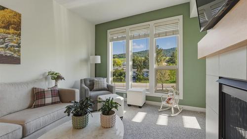 2303-7343 Okanagan Landing Road, Vernon, BC - Indoor Photo Showing Living Room With Fireplace