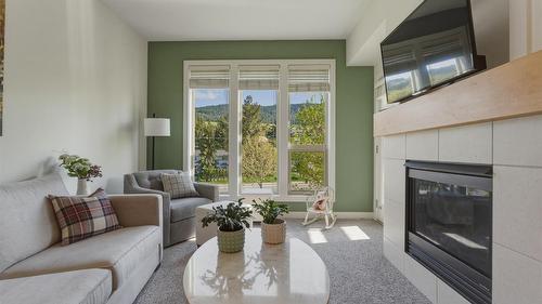 2303-7343 Okanagan Landing Road, Vernon, BC - Indoor Photo Showing Living Room With Fireplace