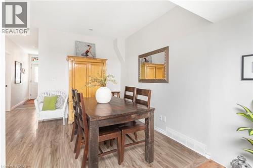 Light wood-finish flooring extends through this room and into the entryway - 134 Erie Avenue, Hamilton, ON 