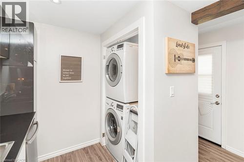 Dedicated laundry area with stacked washer and dryer - 134 Erie Avenue, Hamilton, ON 