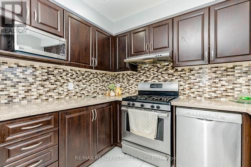 Kitchen with Stylist Backsplash - 1135 Bellarosa Lane, Mississauga, ON 