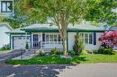 Ranch-style exterior with white siding and dark green trim - 137 Wesley Crescent, Waterloo, ON 