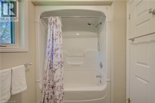 White fiberglass tub and shower combination with chrome fixtures - 137 Wesley Crescent, Waterloo, ON 