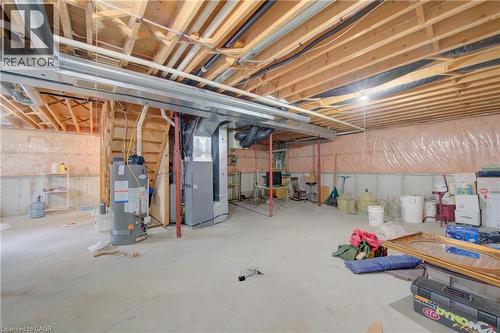 Unfinished basement with concrete flooring and exposed ceiling joists - 137 Wesley Crescent, Waterloo, ON 