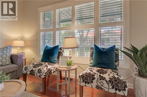 Hardwood-finish flooring complementing light-toned walls - 137 Wesley Crescent, Waterloo, ON 