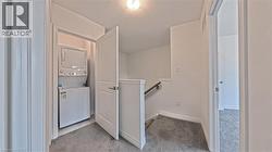 Integrated laundry closet with stacked appliances - 