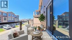 Outdoor balcony featuring glass panel railings, wood-look flooring, and a sliding glass door - 