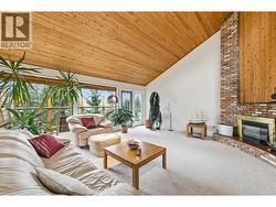 Large windows framing the lake views & patio access - 