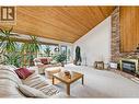 Large windows framing the lake views & patio access - 324 Clifton Road N, Kelowna, BC 