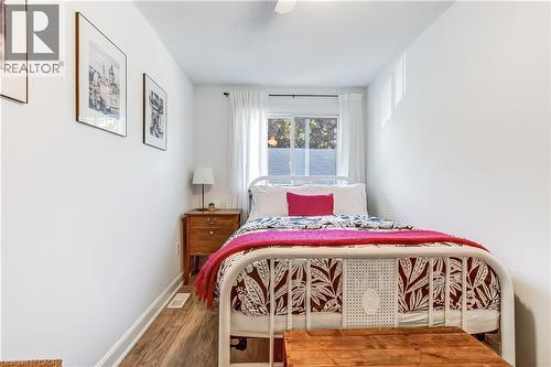 Wood-finish flooring with white baseboards - 218 Richardson Drive Unit# 26, Port Dover, ON 