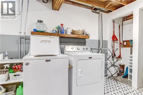 Laundry area featuring a top-load washing machine and front-load dryer - 218 Richardson Drive Unit# 26, Port Dover, ON 