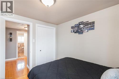 Bedroom featuring light-toned wall paint and a flush-mount ceiling light - 366 Berkindale Drive, Hamilton, ON 