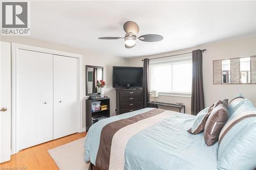 Hardwood-finish flooring complementing a neutral wall palette - 366 Berkindale Drive, Hamilton, ON 