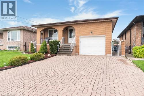 Brick exterior with an arched entry porch - 366 Berkindale Drive, Hamilton, ON 