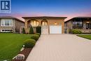 Brick exterior residence featuring an arched portico, a white garage door, and an elevated entrance with a white railing - 366 Berkindale Drive, Hamilton, ON 