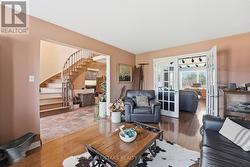 Living Room with hardwood floor & french doors - 