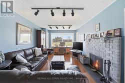 Family room with fireplace & picture window - 