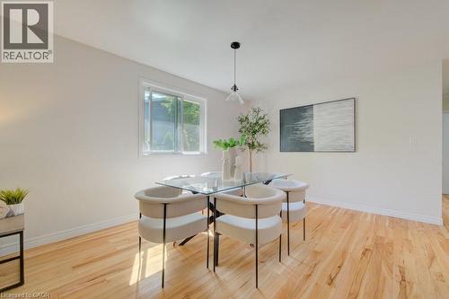 Bright interior space with light-toned walls and wood-finish flooring - 60 Mayfield Avenue, Waterloo, ON 