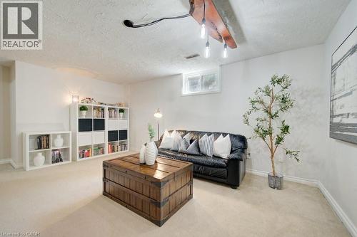 Spacious room with light-toned carpeting and white walls - 60 Mayfield Avenue, Waterloo, ON 