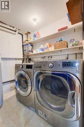 Dedicated laundry area featuring front-loading washer and dryer units - 60 Mayfield Avenue, Waterloo, ON 